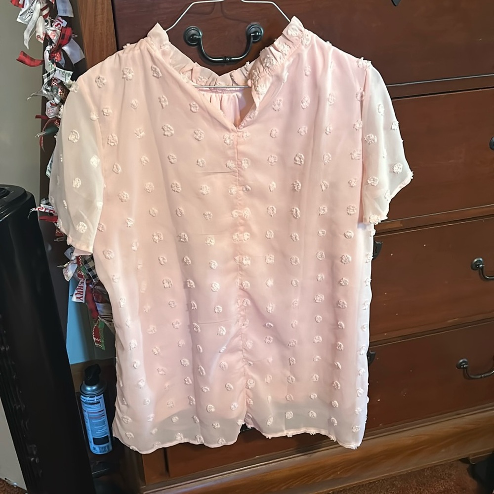 Cute baby pink top, decorated with small Pom poms